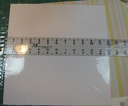 Setting right side of ruler at 12 inches on scrapbook album page